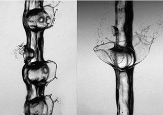 High-speed black and white photo of a jet of liquid vaporizing.